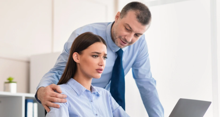 man uncomfortable touching womans shoulder