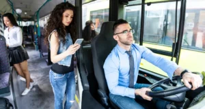 bus driver and passenges standing