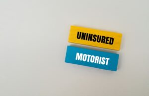 Colorful block with text UNINSURED MOTORIST